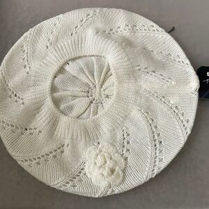 Knitted white beret